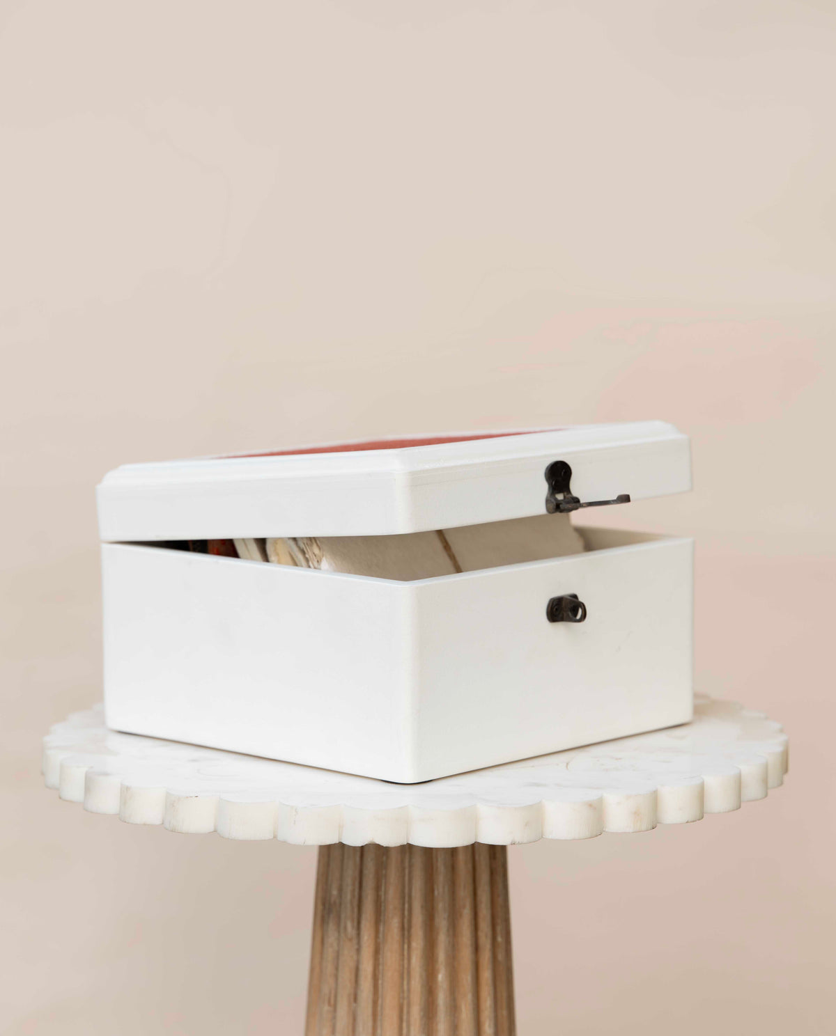 A white wooden storage box with a hinged lid