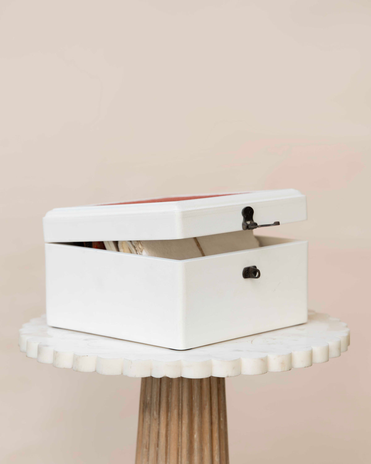 A white wooden storage box with a hinged lid