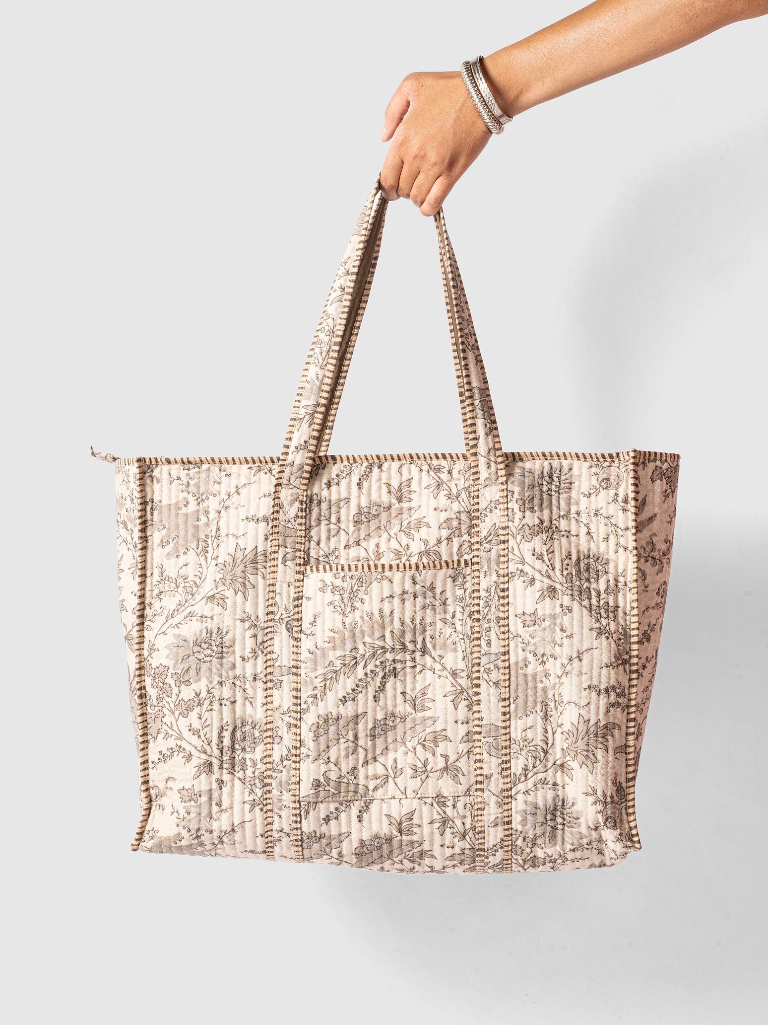 Woman holding a french printed design tote bag 