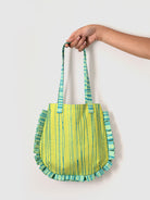 Green and blue striped mini tote bag with ruffled edges