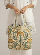 Girl holding a floral-patterned tote bag 